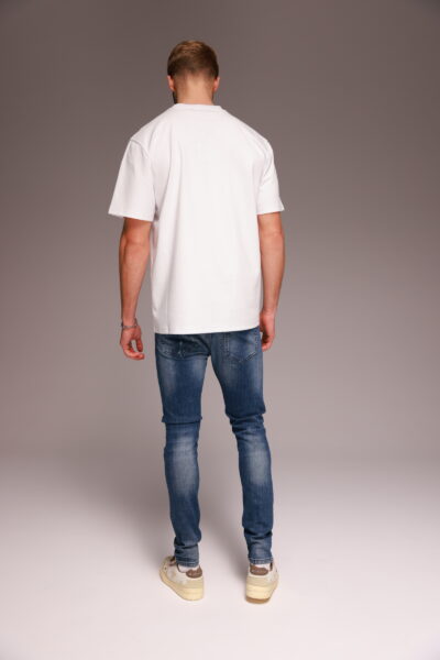 ג'ינס סקיני כחול עם שטיפות וקרעים מבית W JEANS.